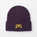 Minimalist purple beanie with gold pixel art game controller logo